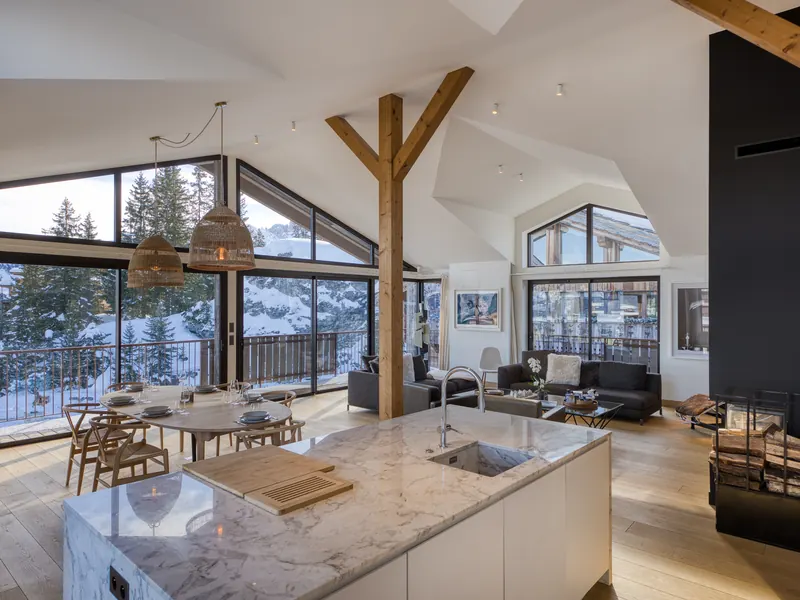 The open living space of Apartment Prada, a bright A-frame of glass above Courchevel 1850