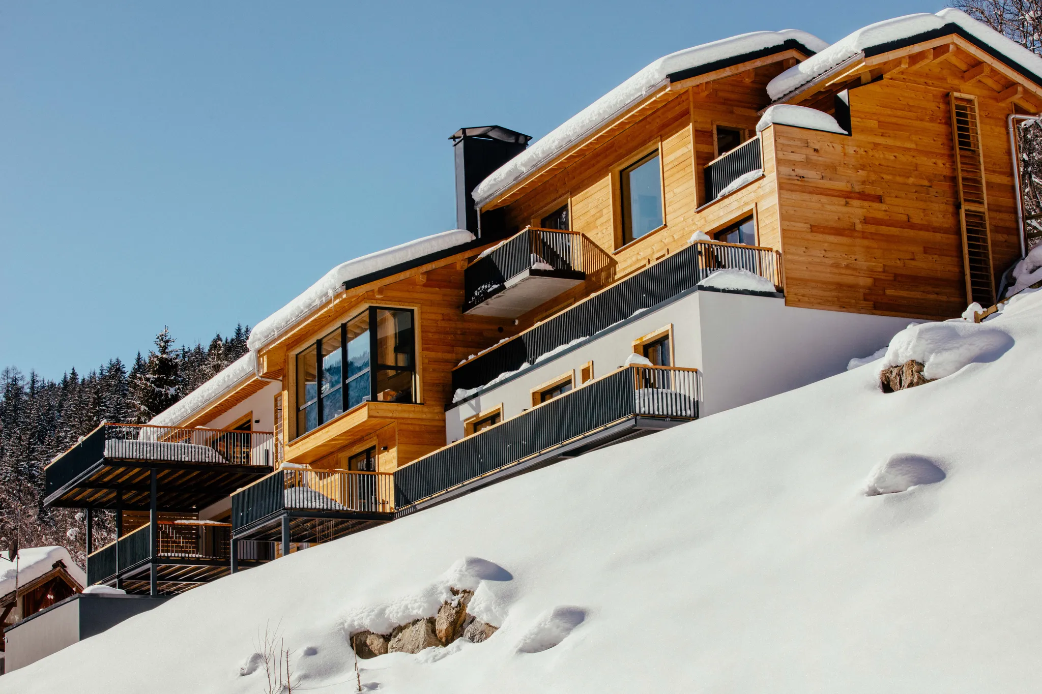 The chalet under fresh snow, in full daylight